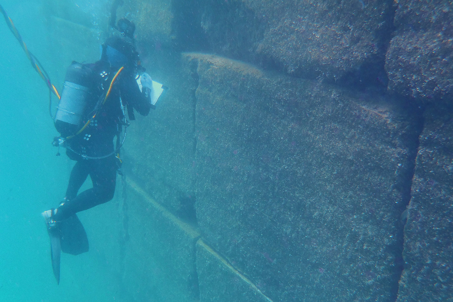 A diver inspects a gravity stone jetty.