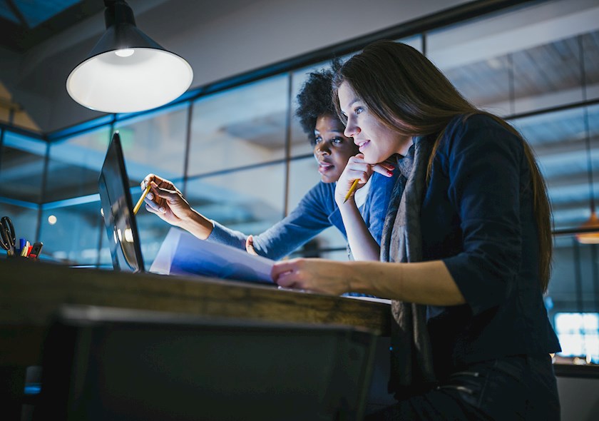 Two women in discussion, office environment