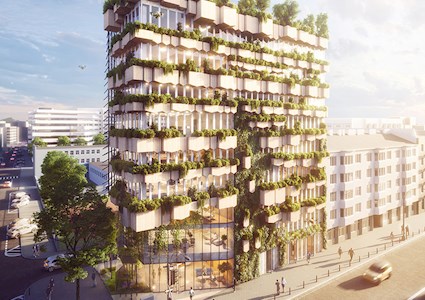 Image shows a multistory building with greenery moving up the facade. 