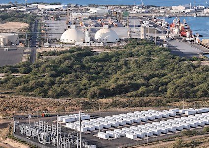 view of oversized batteries near a waterfront