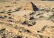 aerial view of a pyramid in the desert
